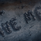 The message Ozymandias has spelled on the surface of a moon.